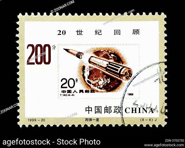 CHINA - CIRCA 1999: A Stamp printed in China shows the review of the 20th century with a rocket, circa 1999