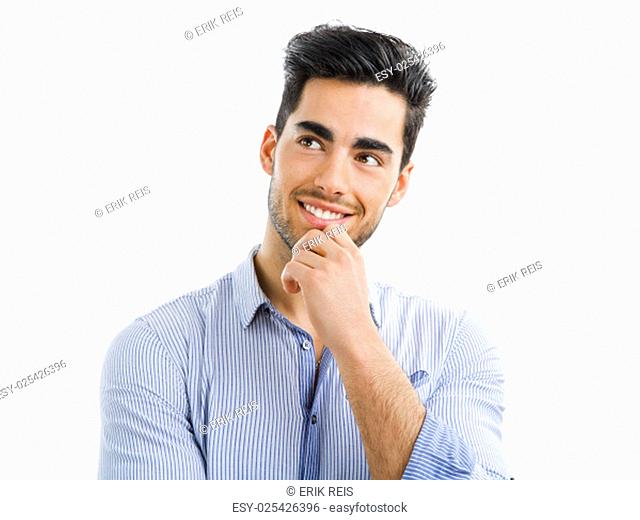 Happy and handsome young man talking at phone, isolated on white background