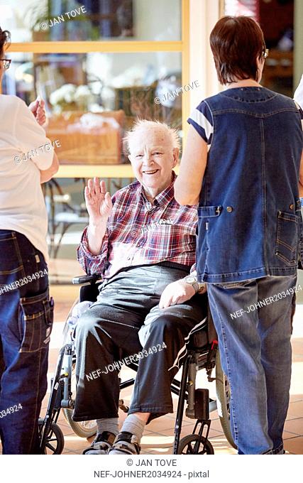 Senior man on wheelchair in care home