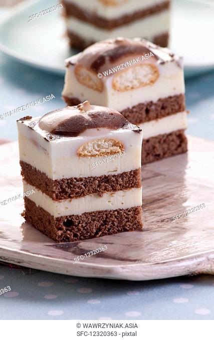 Milk and chocolate cake with sponge cake topped