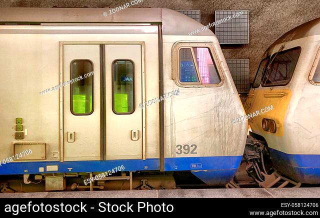 Antwerp, Belgium - June 2019: Two Belgian trains on the tracks of the Antwerp Central railway station