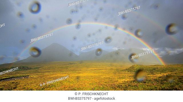 view through a wet window to a rainbow in the Scottish Highlands, United Kingdom, Scotland, Isle Of Skye
