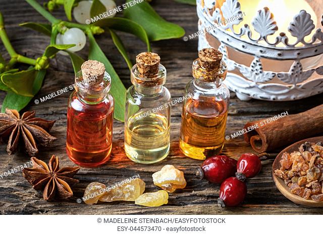 Christmas collection of essential oils with frankincense, myrrh, cinnamon and mistletoe