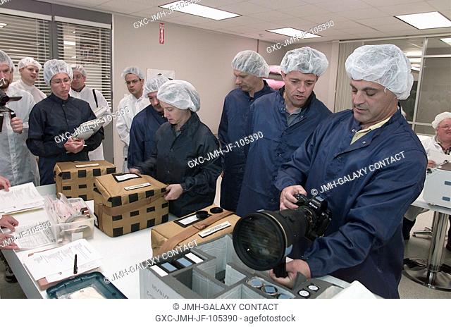 The STS-112 crewmembers inspect flight hardware during a crew equipment bench review in an offsite facility near the Johnson Space Center (JSC)