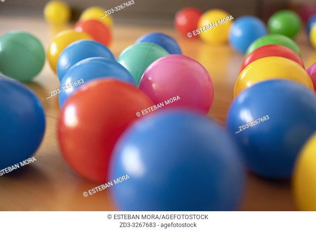 Colour balls on wood floor