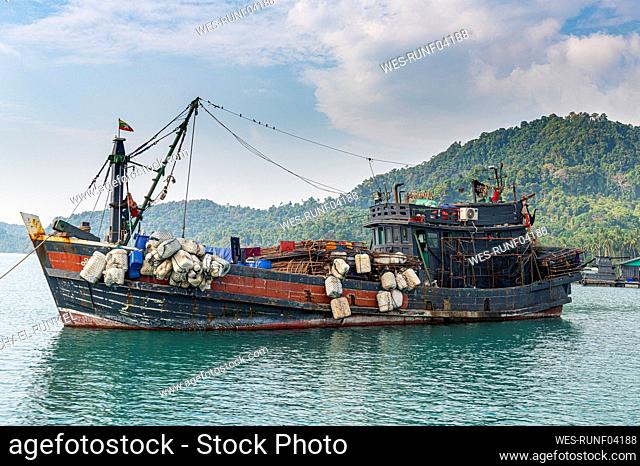 Myanmar, Tanintharyi Region, Old fishing boat moored in¶ÿMergui Archipelago