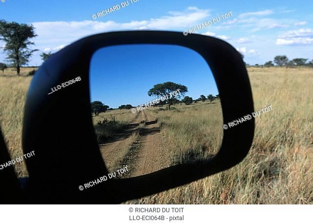 Reflection of the Dirt Road in the Side Mirror of a Car  Vaalbos National Park, Northern Cape Province, South Africa