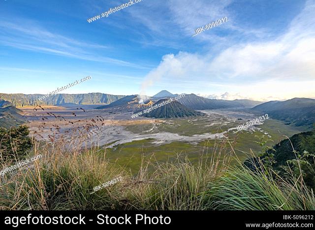 View of volcanic landscape, volcanoes, smoking volcano Gunung Bromo, Mt. Batok, Mt. Kursi, Mt. Gunung Semeru, Bromo-Tengger-Semeru National Park, Java