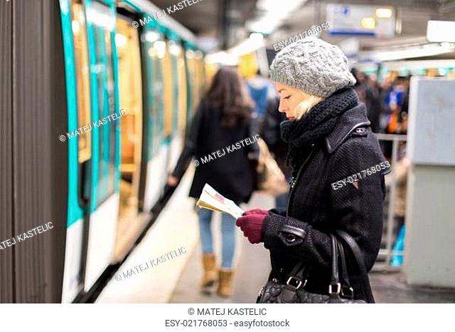 Lady waiting on subway station platform