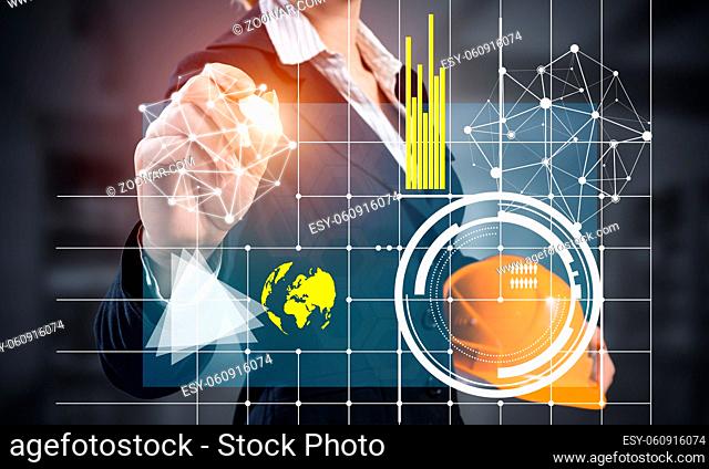 Businesswoman pointing on 3d financial graph. Woman in business suit standing with safety helmet. Digital technology and innovation in construction industry