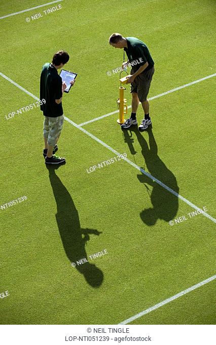 England, London, Wimbledon. Groundsmen conducting a bounce test on Court 8 in preparation for play at the 2011 Wimbledon Tennis Championships