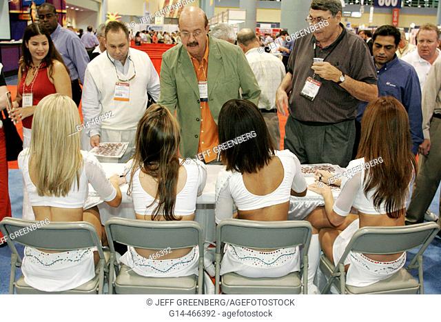 Convention Center, Americas Food and Beverage Show, Miami Dolphin Cheerleaders sign autographs. Miami Beach. Florida. USA