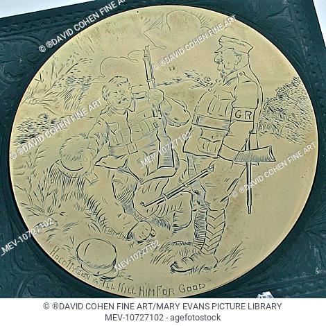 'An engraved brass teapot stand containing a cartoon - 'Hold my gun and I'll kill him good' on a carved bakelite base. This amusing cartoon shows the efforts of...