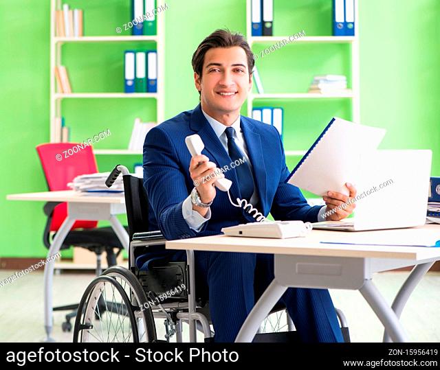 The disabled businessman working in the office