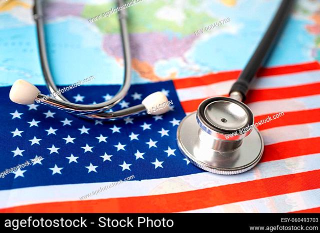 Black stethoscope with USA America flag on world map background, Business and finance concept