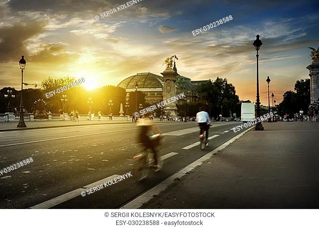 View on Grand Palais in Paris from Pont Alexandre III at sunset, France