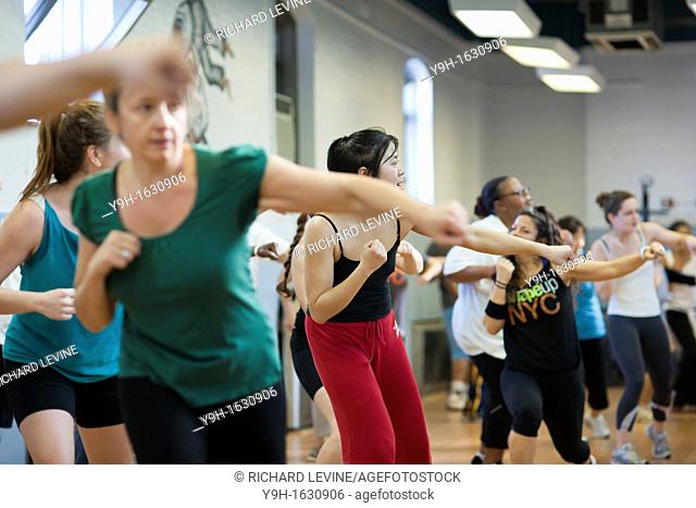 Exercisers participate in an exercise class at the Metropolitan Recreation Center in Brooklyn in New York as part of the Parks & Recreation Dept Shape Up NYC...