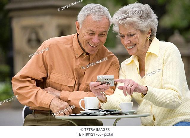 Senior couple having coffee at outdoor café