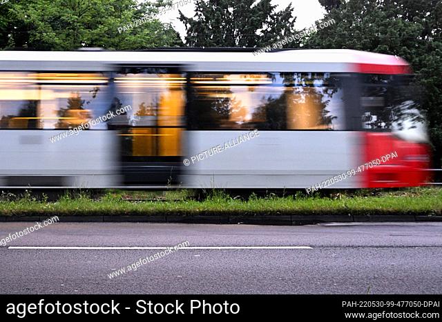30 May 2022, North Rhine-Westphalia, Cologne: A streetcar crosses the tracks in the early morning. The Association of German Transport Companies (VDV) expects...