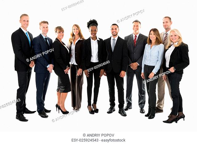 Full length portrait of confident business team standing against white background