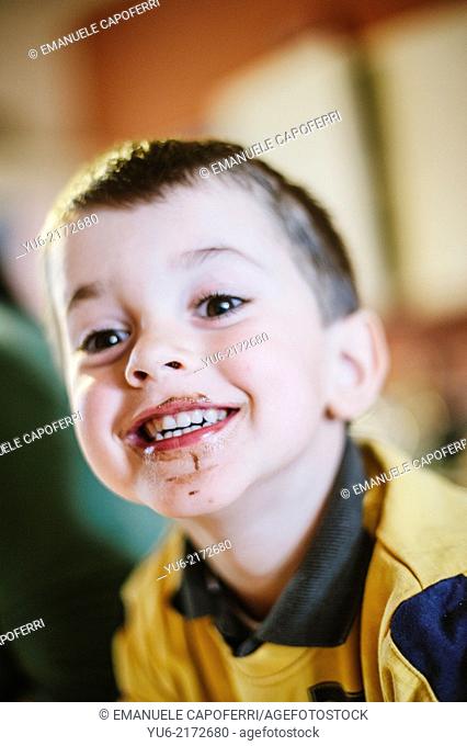 Portrait of smiling baby, dirty mouth chocolate