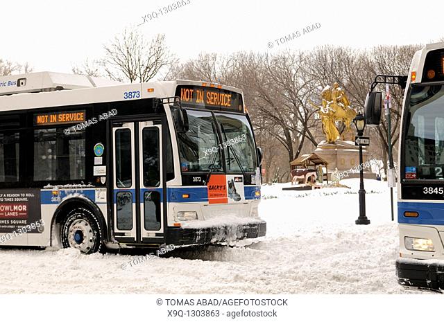 MTA public bus traversing central park via Central Park South to 5 th avenue, Bus sign reads 'Out of Service'