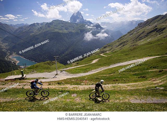 France, Pyrenees Atlantiques, downhill mountain biking from Train d'Artouste departure station, view of Fabreges Lake and Pic du Midi d'Ossau (2884m)