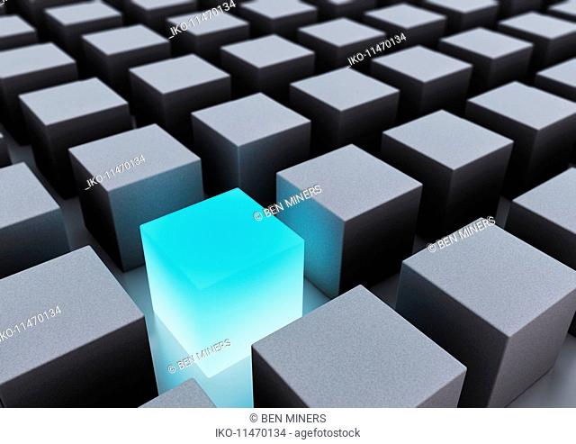 Abstract gray cubes and glowing blue cube