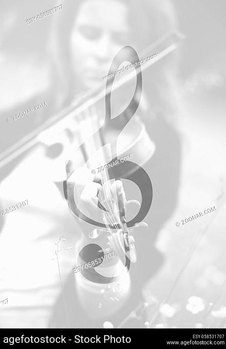 Violinist and Violin clef. Music concept