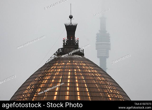RUSSIA, MOSCOW - AUGUST 29, 2023: A view shows the dome of the VDNKh Space Pavilion, with the Ostankino TV Tower in the background