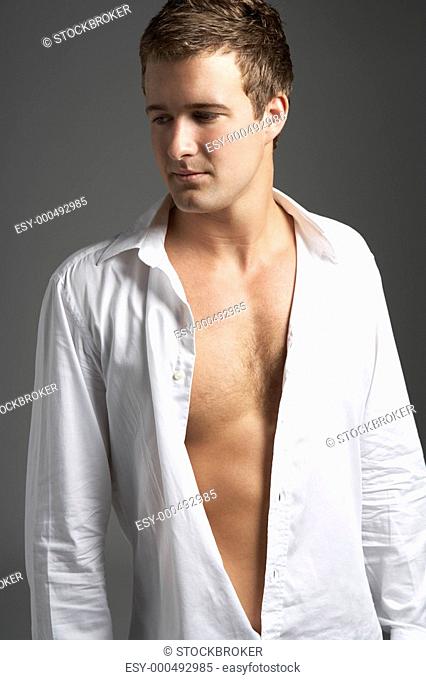 Studio Portrait Of Young Man Wearing Open Shirt