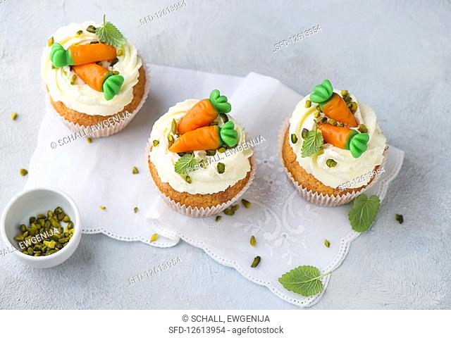 Decorated cream cheese cupcakes with pistachios