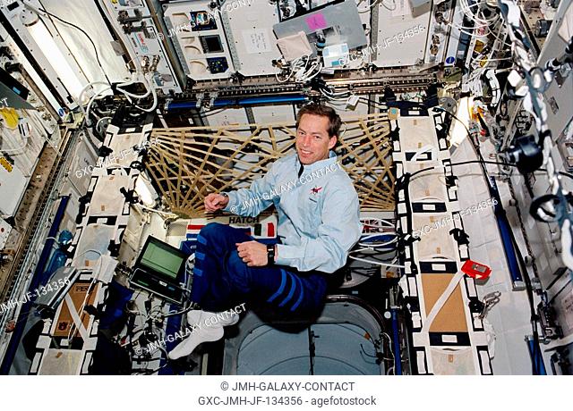 Astronaut James D. Wetherbee, STS-113 mission commander, floats in the Destiny laboratory on the International Space Station (ISS)
