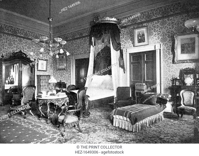 President Harrison's bedroom at the White House, Washington DC, USA, 1908. View showing the state bed and a day bed with a cushion embroidered with the name of...