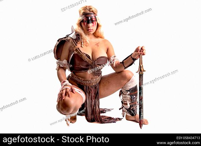 Ancient woman warrior or Gladiator posing with sword, isolated in white