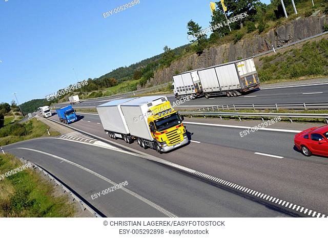 large trucks and traffic on busy highway, elevated view . E4 highway. sweden