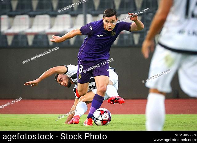 Laci's Regi Lushkja and Anderlecht's Josh Cullen fight for the ball during a game between Albanian club KF Laci and Belgian soccer team RSC Anderlecht