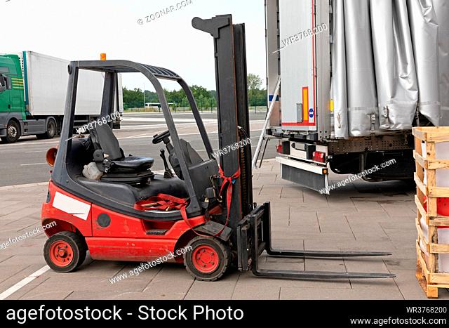 Gas Powered Red Forklift Cargo Truck Outside