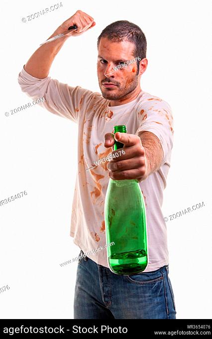 A bloody scene with a man and a blood-covered knife in his hand isolated on white background. Violence and Halloween concept