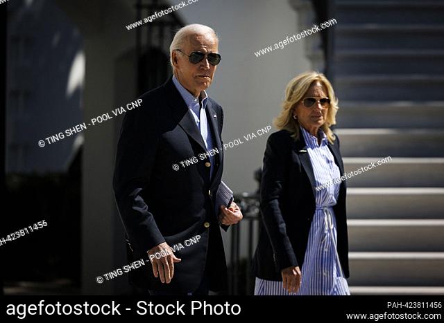 United States President Joe Biden and first lady Dr. Jill Biden walk on the South Lawn of the White House before boarding Marine One in Washington, DC, US