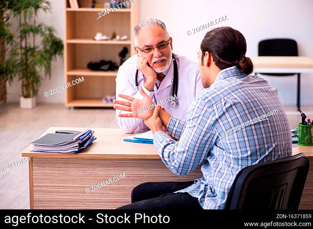 Young male patient visiting experienced male doctor