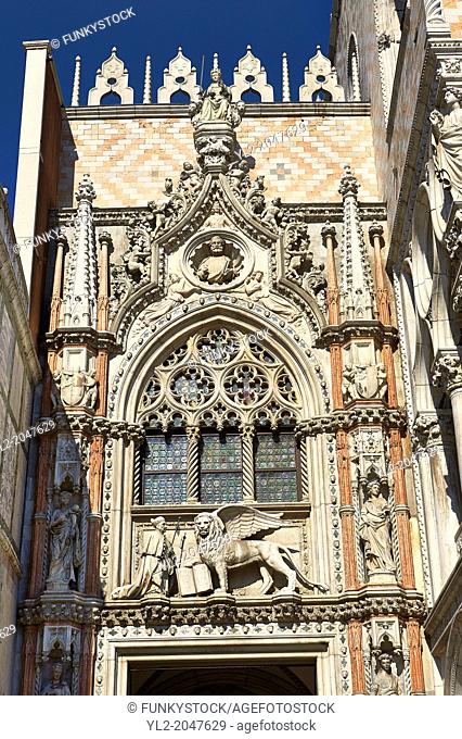Gothic style Ceremonial entrance, the Porta della Carta ( 1438-1442), on the eastern facade of The Doge's Palace with statues of sculptural portrait of the Doge...
