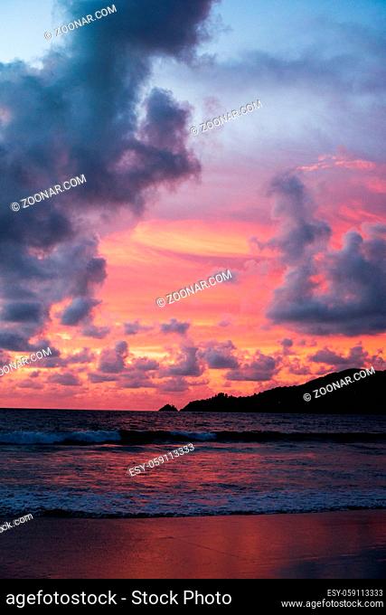 Beautiful summery colorful sunset sky over the sea
