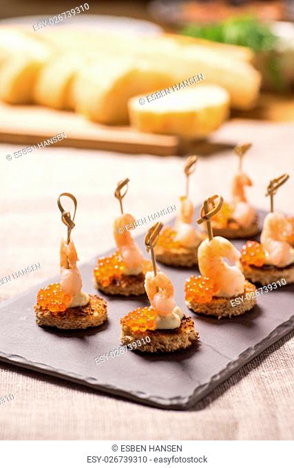 Shrimp Appetizer served on toasted bread with golden Caviar