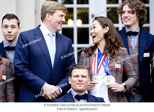 Dutch King Willem-Alexander (C), receives Dutch participants of the Paralympic Games 2014 in Sochi, Bibian Mentel (Gold, Snowboard, 2nd R)