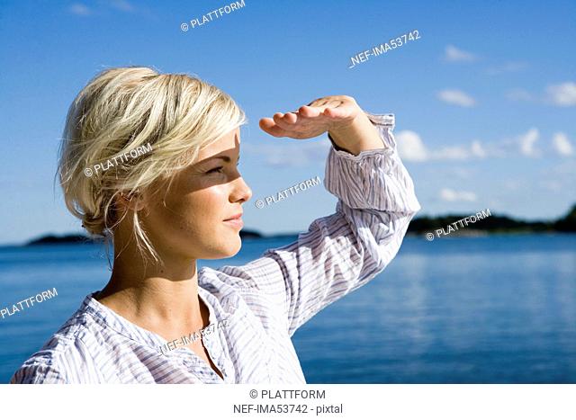 A woman by the sea in the archipelago of Stockholm, Sweden