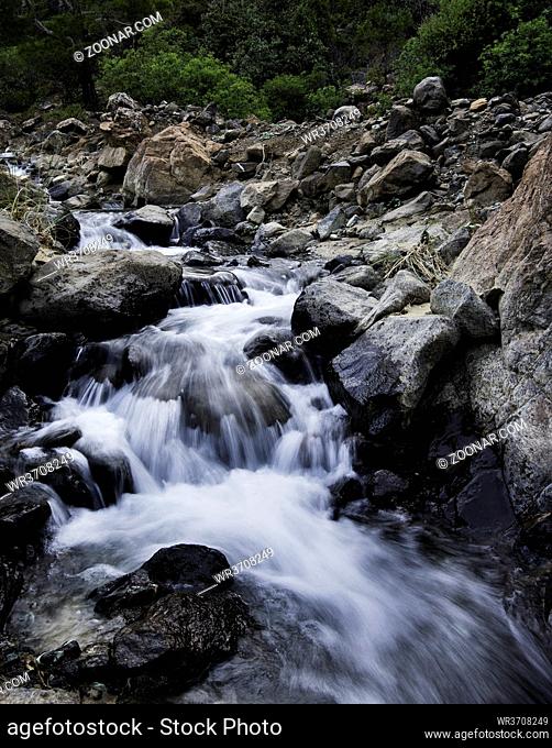 Water flowing in a river creating beautiful small waterfalls at Troodos mountains in Cyprus