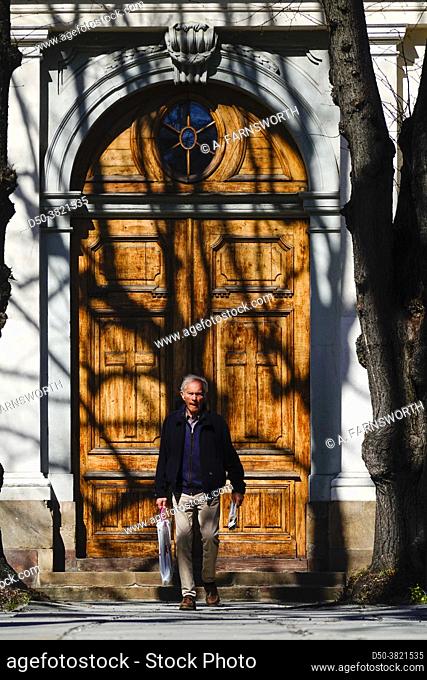 Stockholm, Sweden A man walks in fron tof the door of the Adolf Fredriks church,