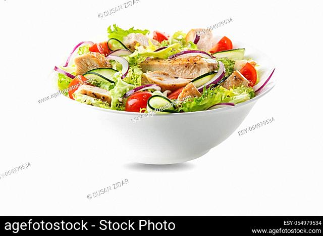 Healthy green salad with chicken breast and fresh vegetables isolated on white background