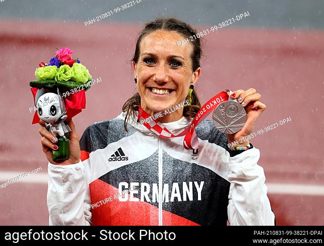31 August 2021, Japan, Tokio: Paralympics: Athletics, women's 200 metres, final, T64, at the Olympic Stadium. Irmgard Bensusan from Germany celebrates her...